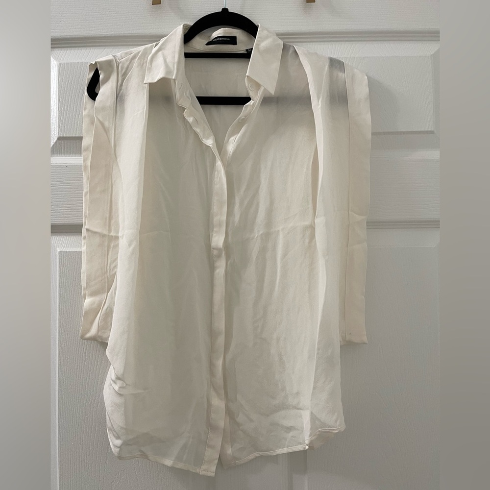 Unconditional semi sheer sleeveless blouse